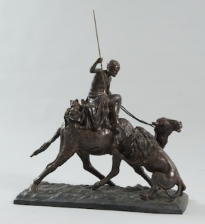 Cast Metal Alloy Grouping With Applied Brown Patina, Depicting A Lion Attacking An Arab Hunter by Vincenzo CINQUE